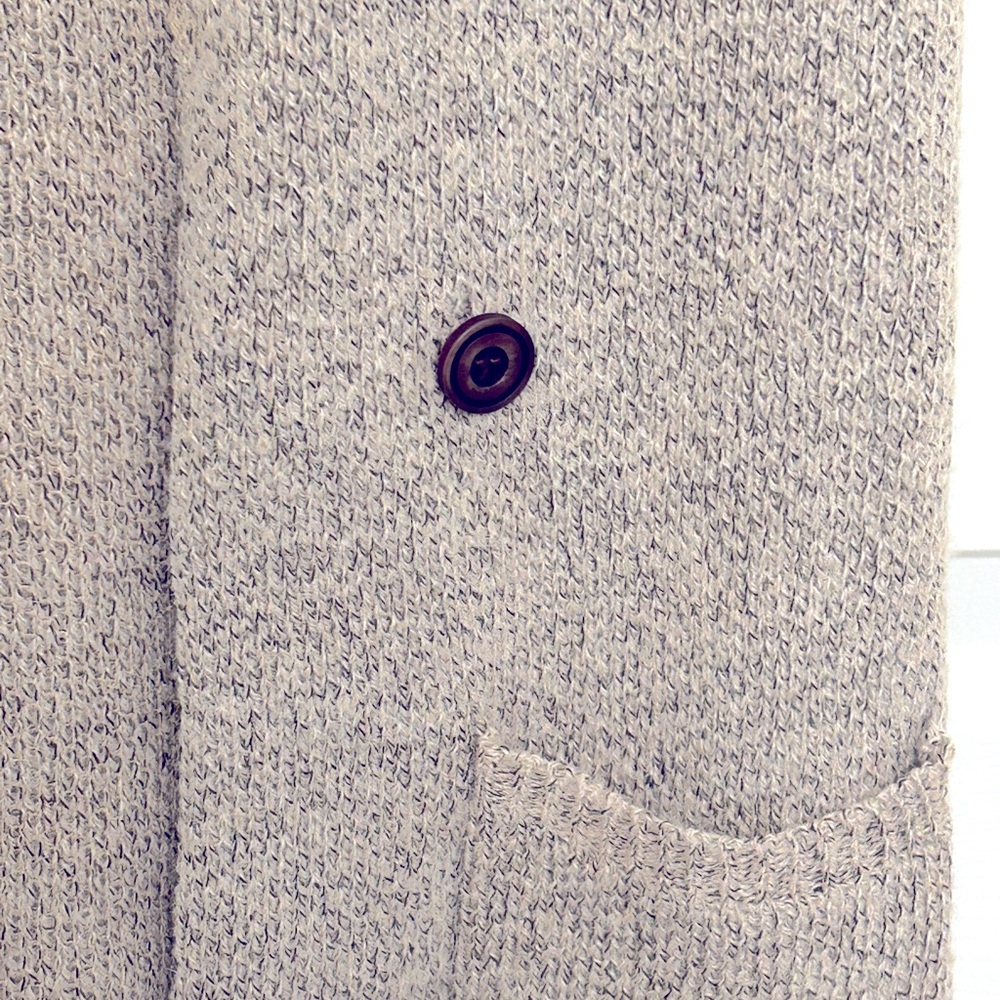 Long women’s sleeveless cardigan.